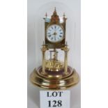 A polished brass Schatz 400 Day anniversary clock under a glass dome. Overall height is 29cm.