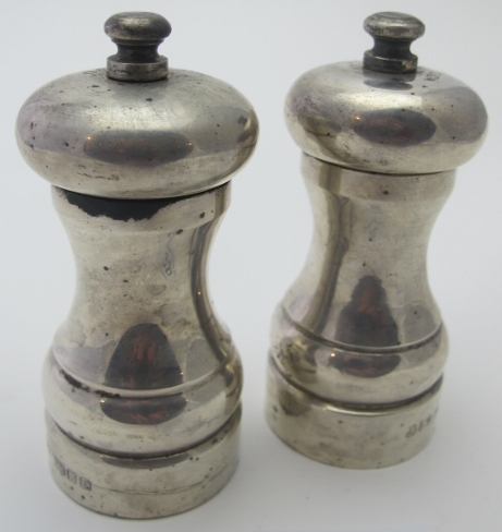 A pair of modern silver 'Peter Piper' pepper and salt grinders, London 1990, some salt damage.