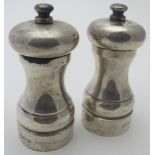 A pair of modern silver 'Peter Piper' pepper and salt grinders, London 1990, some salt damage.