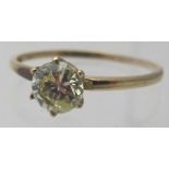 A 10k marked single stone yellow diamond ring with large flaw, approx .5 carat, size O.
