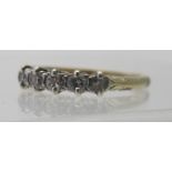 An old five stone diamond ring with engraved sides, alterations possibly sizing,