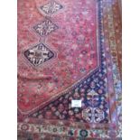 A fine mid 20's Persian carpet on red ground with even wear and colour. 295cm x 220cm.