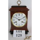 A modern Warmink striking mantel clock with twin bells.