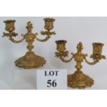A pair of two branch French Ormolu candlesticks in classic Rococo style. Overall height is 14.5cm.