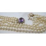 A fine individually knotted three strand pearl necklace,