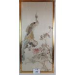 A large antique Chinese silk panel in glazed gilt frame depicting a peacock and branches against an