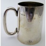 A plain silver pint tankard with 'C' handle, London 1924, approx weight 345 grams/11 troy ounces.