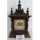 A late 19th Century Junghans oak cased striking mantel clock in the Gothic style.