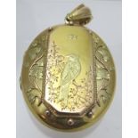 A 15ct gold double oval locket,