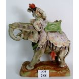 A large porcelain Imperial Amphora Teplitz figure of an Indian Elephant with rider, signed 'VOGL'.