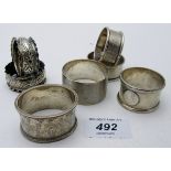 A collection of seven silver napkin rings, to include two pairs, all fully hallmarked,