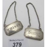 A pair of Georgian Scottish silver wine labels, whisky and brandy, Glasgow 1832, makers JM/WM,