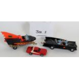 A Corgi toys Batman Batmobile car, a Batman Batboat and trailer,