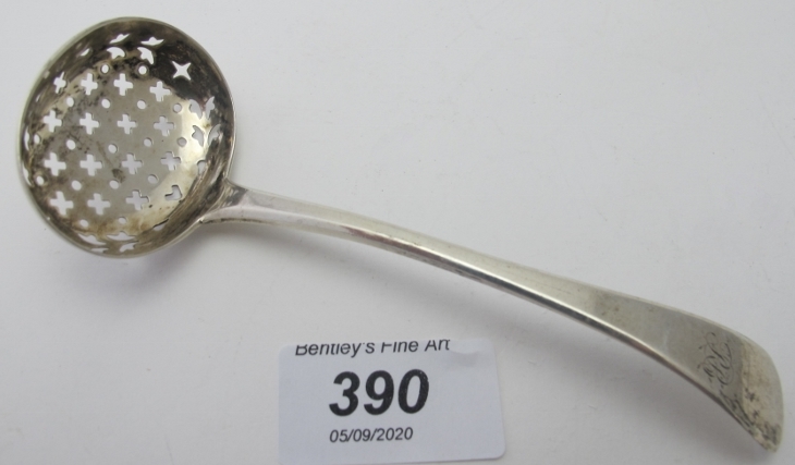 A Georgian silver sifter spoon, London 1823, approx 32 grams/1 troy ounce.