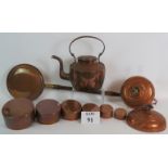 A quantity of copper items including a large heavy duty antique kettle, two bed warming flasks,