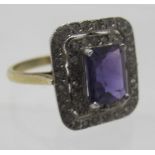 An Art Deco style silver ring set with centre emerald cut amethyst, approx 10mm x 8mm, size P,