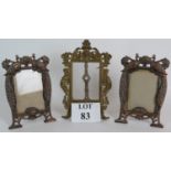 A pair of antique bronzed cast iron picture frames with peacock relief,