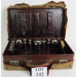 A fitted leather gentleman's travel case, Circa 1930's, with cut glass bottles and pots,