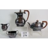 A four piece silver plated tea set with teak handles, stamped Poston Products Lonsdale Silverware.
