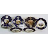 A collection of eight antique Coalport plates and dishes with hand painted lake land scenes within