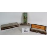 Three vintage Hohner harmonicas: 1) An Echo Harp in original box, keys C and G.