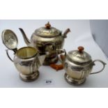 A three piece silver continental tea service, comprising a teapot, cream jug, and sugar bowl,