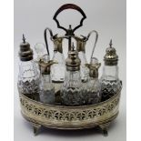 A Georgian silver eight cruet set, the base engraved with scrolls,