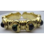 A heavy 18ct yellow gold bracelet, with heart shaped design and set with heart shaped tourmaline,