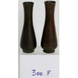 A near pair of antique Chinese bronze vases, 11.8cm tall, with seal character marks to base.