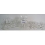 A selection of mainly cut crystal glasses including two Brandy balloons and two petal cut mid 19th
