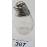A novelty glass pepper, with a chick's head, marked 800, good condition.