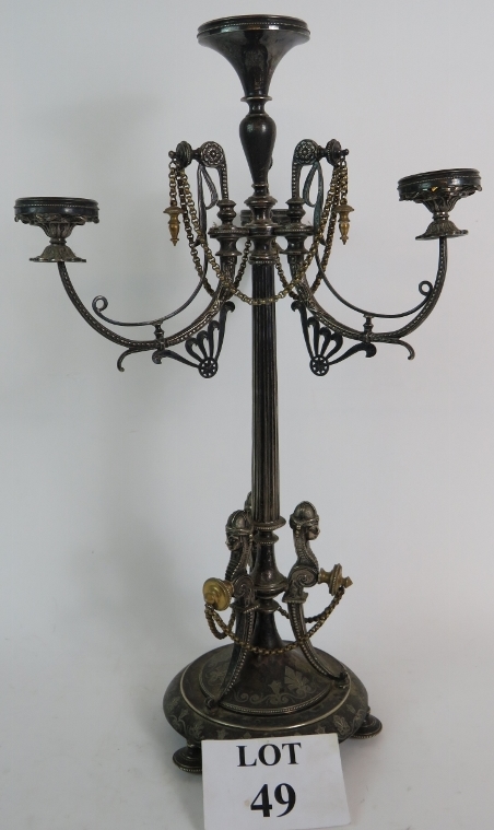 An ornate 19th Century silver plate + gilt table centre piece in the empire revival style.