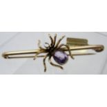 A 9ct gold spider bar brooch, the spider's amethyst body is approx 10mm x 7mm, approx weight 8.
