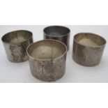 A set of four silver napkin rings, each with engraved number, London 1913,