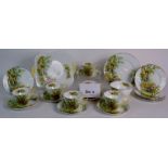 A 21 piece Shelley 'Daffodil Time' tea service including 6 cups and saucers, six side plates,