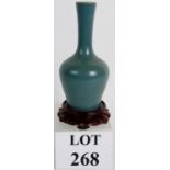 A 19th Century Chinese tea dust stemmed vase with teal coloured glaze.