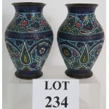 A pair of Champleve enamel vases in the Syrian/ Islamic taste. Height:16cm.