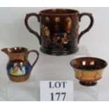 A large treacle glaze two handled pottery frog mug with applied tavern and dog motifs,