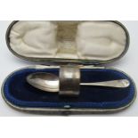 A silver christening spoon and napkin ring, London 1917 and 1918, approx weight 58 grams/1.