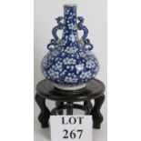 An 18th Century Chinese blue and white bottle vase with dragon handles.