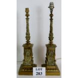 A pair of heavy cast brass empire revival lamp bases, very ornate. Height: 53cm.