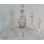 Four cut glass decanters and a cut glass carafe, tallest is 33cm.