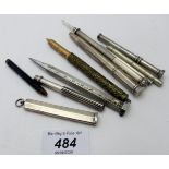 A collection of nine various slide and propelling pencils, three silver, three unmarked,