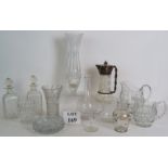 A quantity of vintage and antique glassware including jugs, vases decanters, an ashtray,