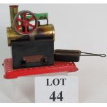 A mamod stationery steam engine with burner. Condition report: Fire staining and rust present.