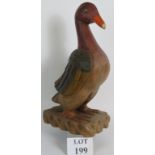 A large decorative carved hardwood duck or goose with hand painted finish. Overall height: 51cm.