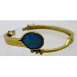 A superb 18ct gold hinged bracelet, set with large oval opal, approx 18mm x 14mm,