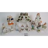 A collection of Staffordshire and continental flat backs and figurines, all hand decorated.