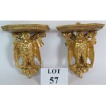 A pair of carved hardwood gilt owl in oak tree wall brackets or shelves.