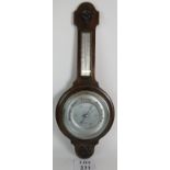 An English 20th Century Shortlands Smith oak banjo barometer with thermometer. Height: 76cm.